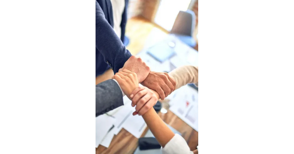 Team Collaboration while holding hands 